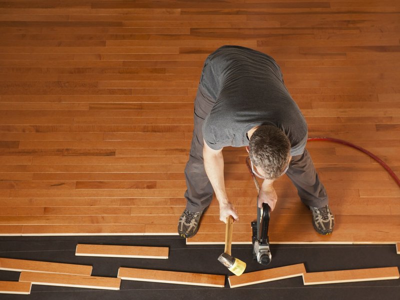 Installing Hardwood into home in West Suite F Clayton, NC area by by Clayton Flooring Center