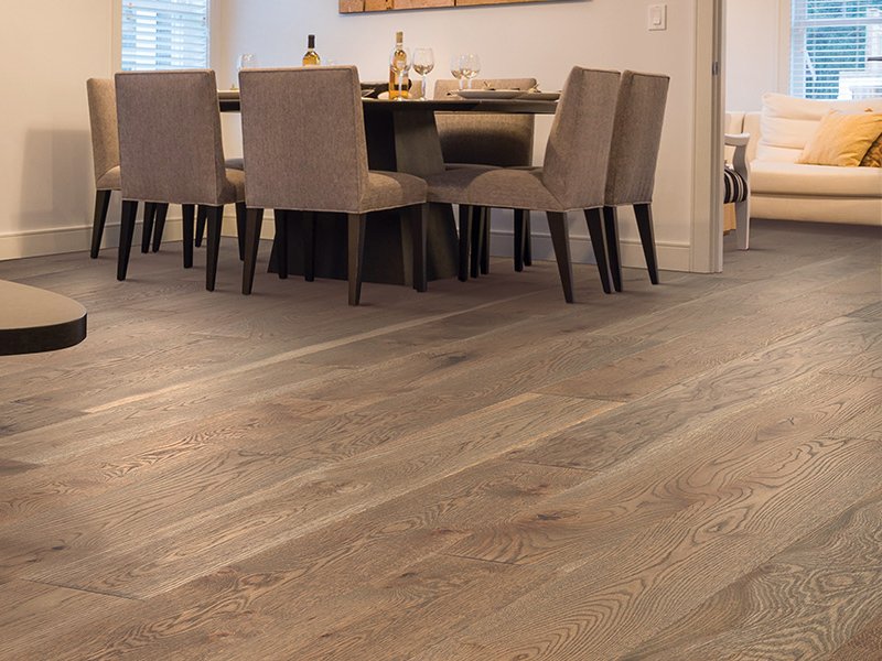 brown hardwood floor and white kitchen furniture in West Suite F Clayton, NC area by by Clayton Flooring Center